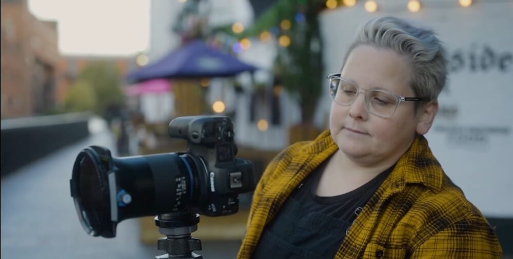 Photographer Verity Milligan prepares to capture a cityscape.
