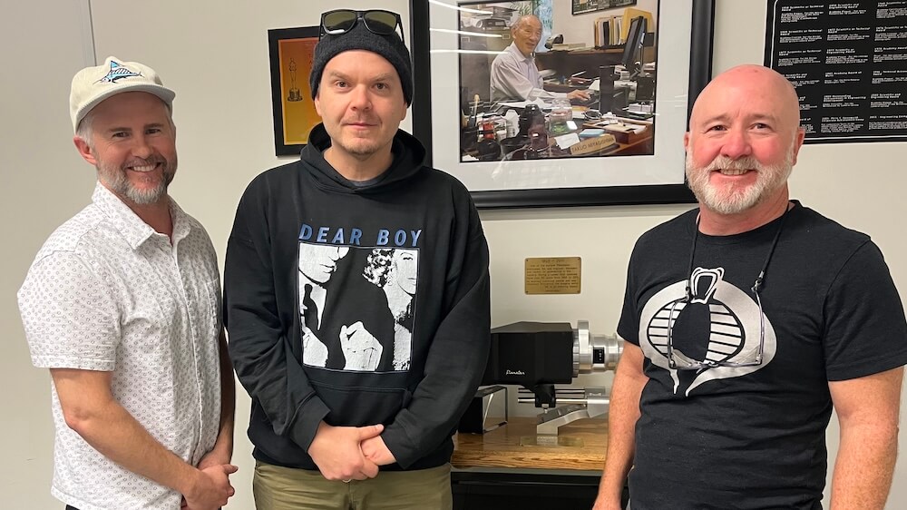 Panavision's Mike Carter (left) and Brian Mills (right) with cinematographer Pawel Pogorzelski